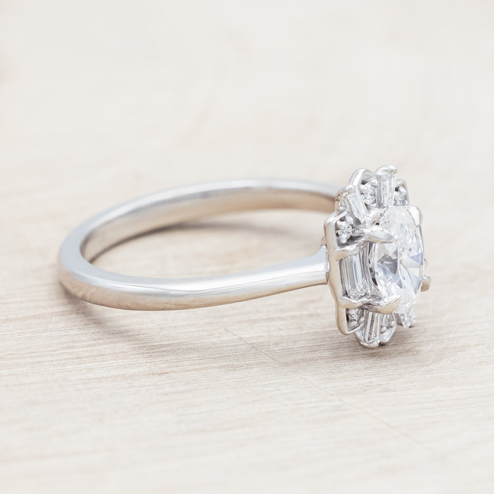 Lab diamond ring with genuine diamond accents against beige background