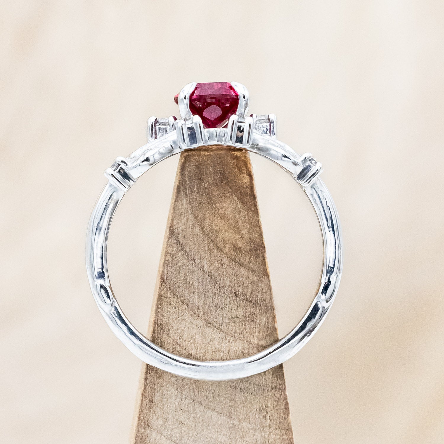 "Harlow" pear cut ruby engagement ring with salt & pepper diamond accents on a branch-inspired band