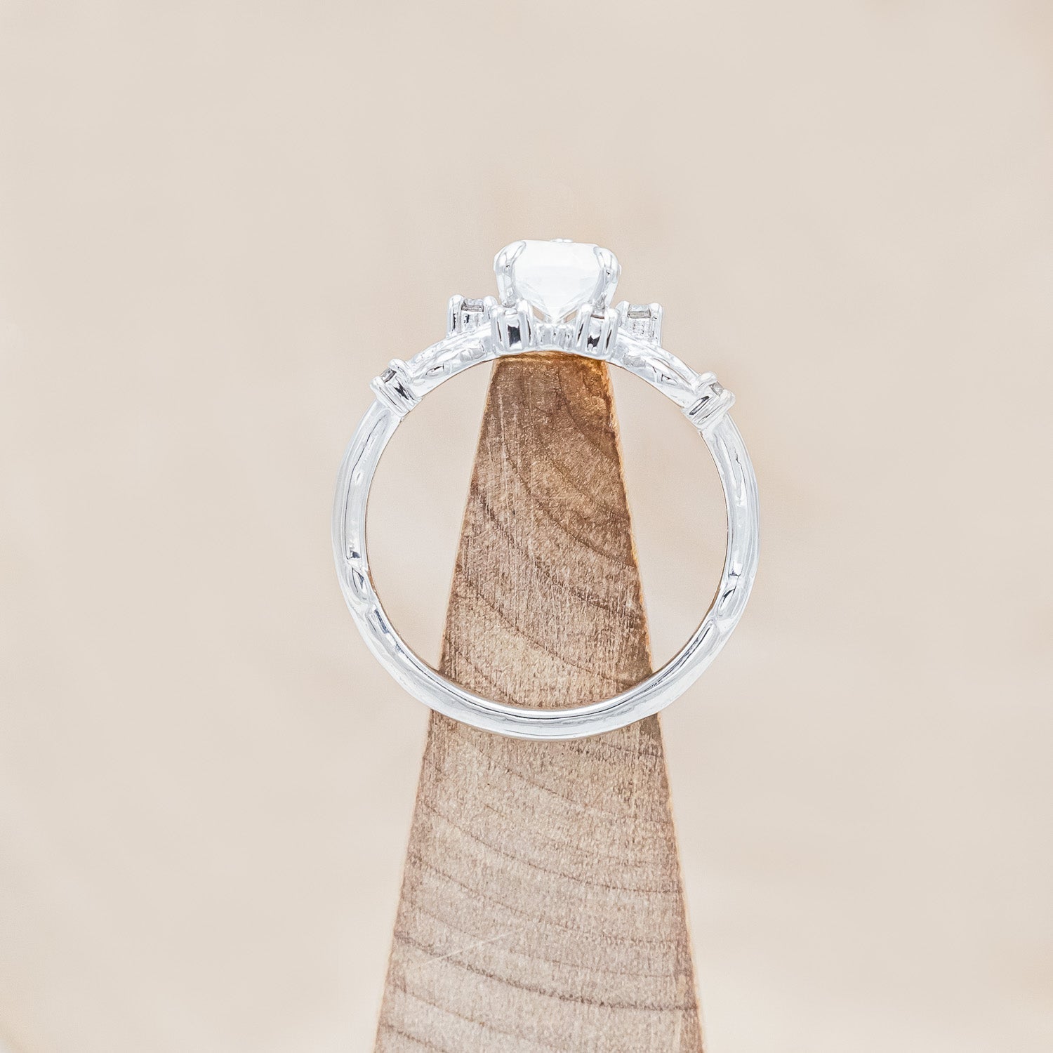 Top view of "Harlow" - moonstone women's engagement ring with salt & pepper diamond accents on a branch-inspired band