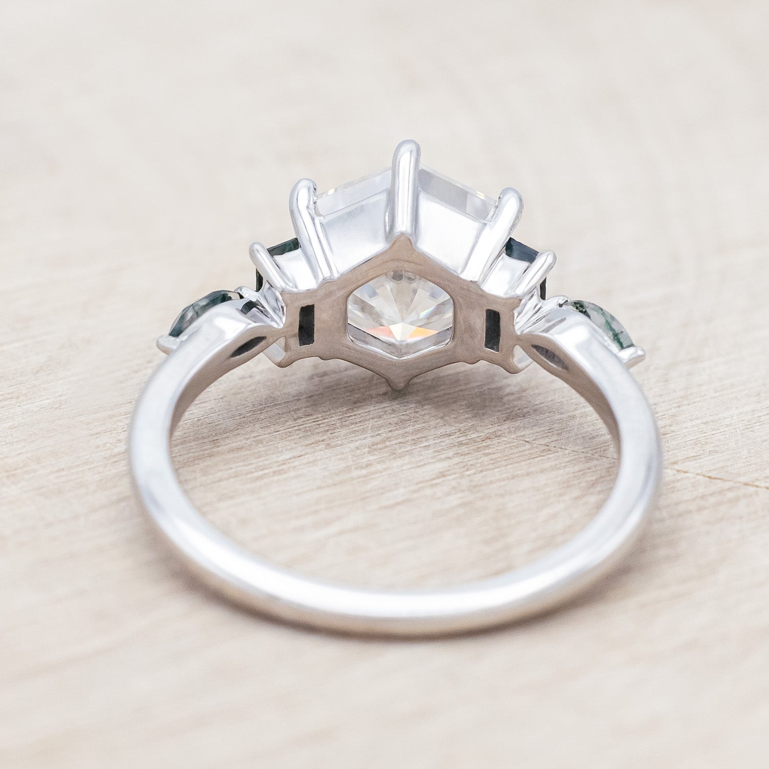 Back side of "Alicent" - hexagon cut Moissanite women's engagement ring with moss agate accents