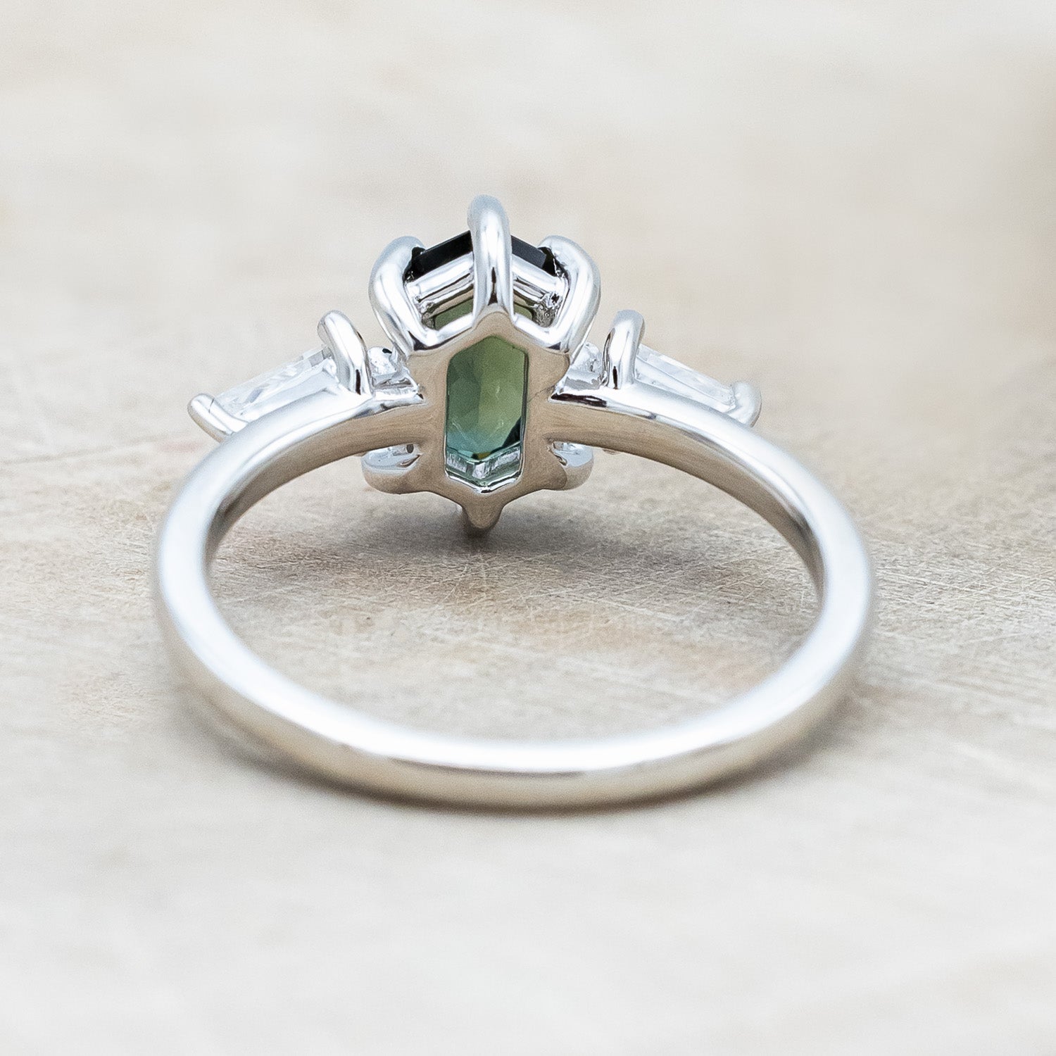 Back view of "Isla" - elongated hexagon cut Australian sapphire with moissanite accents in 14K white gold