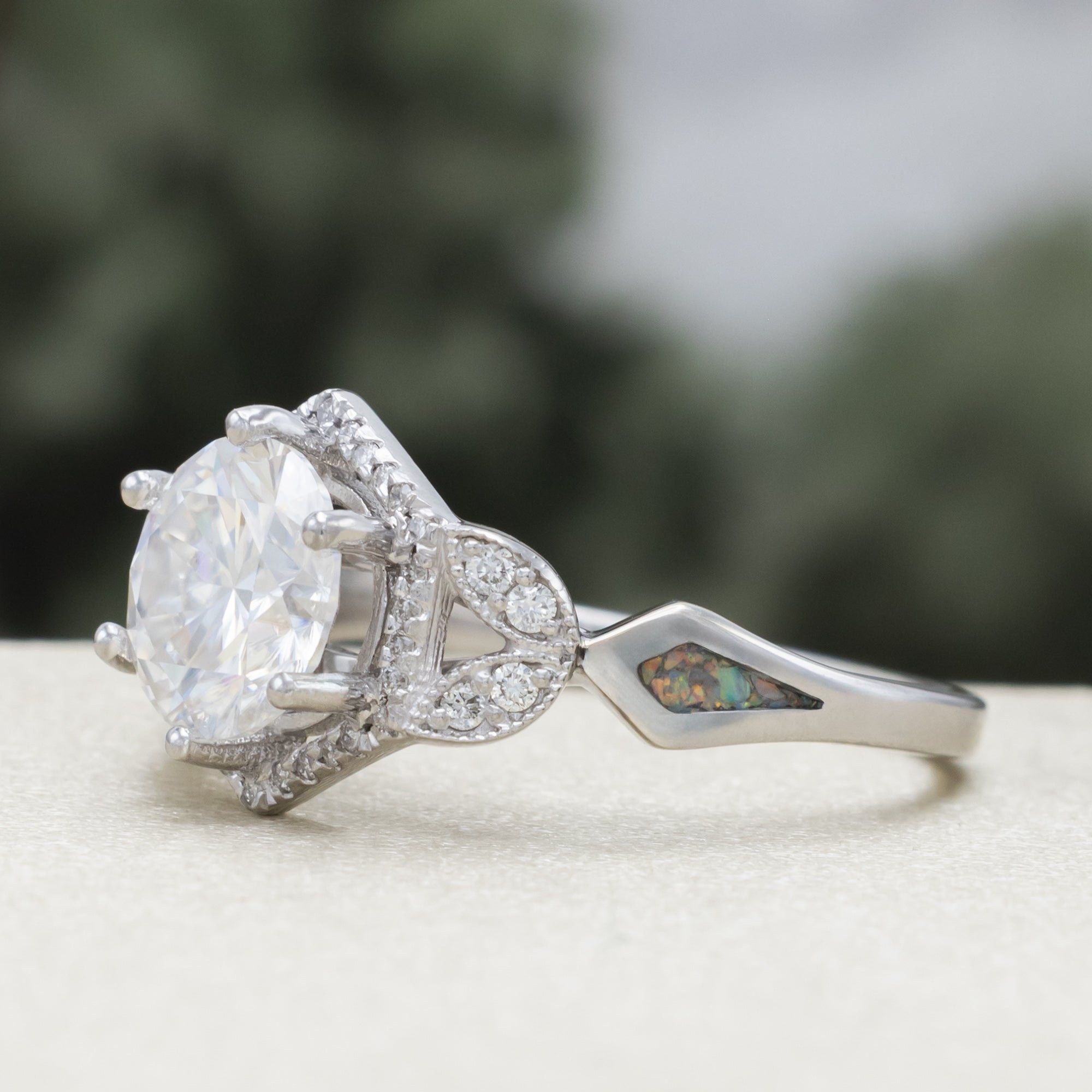 "Lucy In The Sky" - Round Cut Moissanite Engagement Ring With Diamond Accents & Fire And Ice Opal Inlays