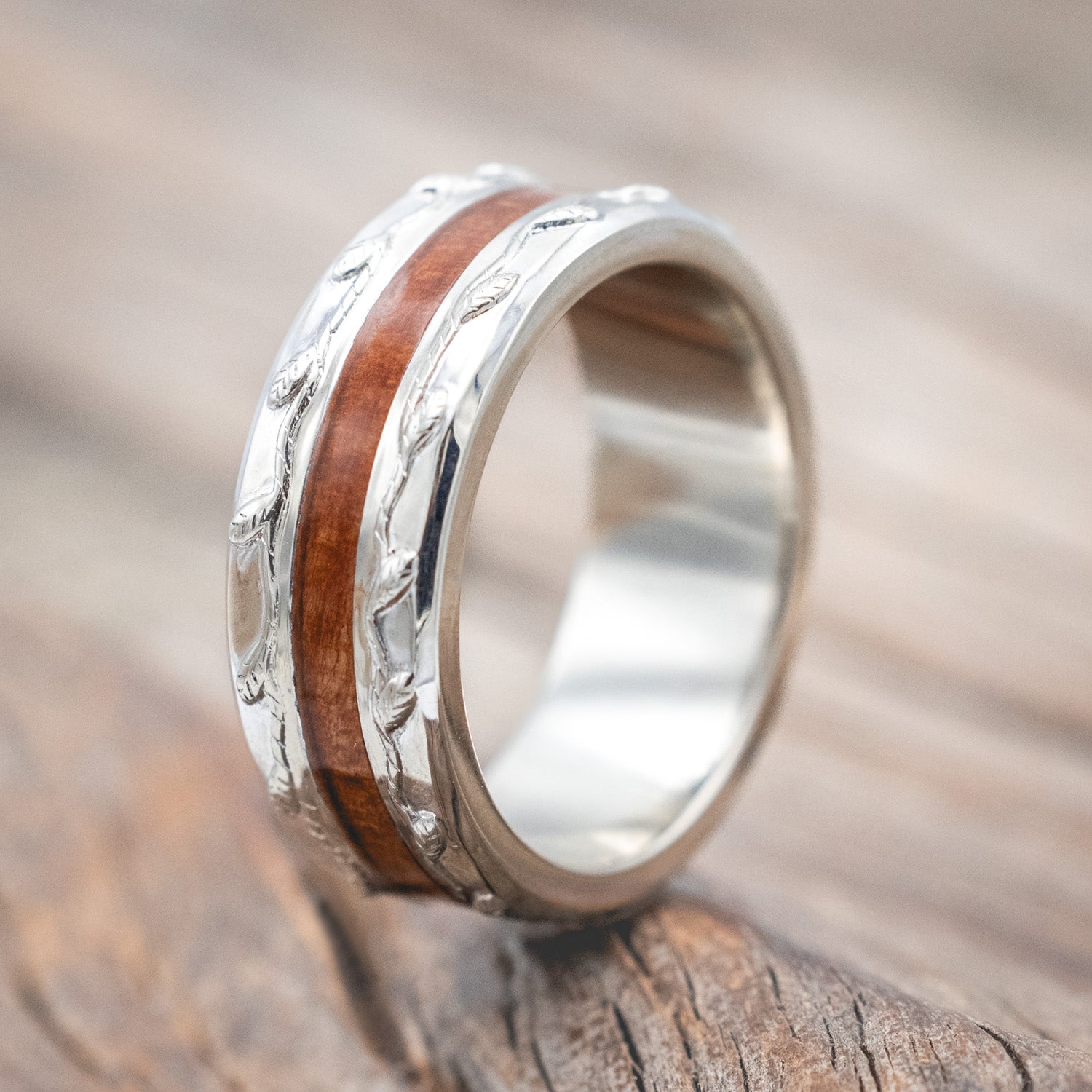 "Nirvana" men's wedding ring with centered redwood inlay and embossed vine in 14K white gold