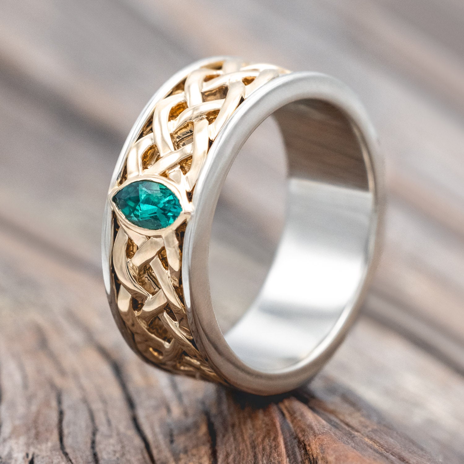 "Oberon" - two-toned men's wedding ring with Celtic knot filigree and lab-grown emerald accent