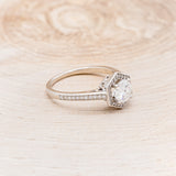 "ODESSA" - ROUND CUT MOISSANITE ENGAGEMENT RING WITH DIAMOND HALO & ACCENTS