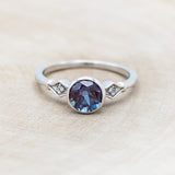 ROUND CUT LAB-GROWN ALEXANDRITE ENGAGEMENT RING WITH DIAMOND ACCENTS