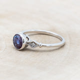 ROUND CUT LAB-GROWN ALEXANDRITE ENGAGEMENT RING WITH DIAMOND ACCENTS