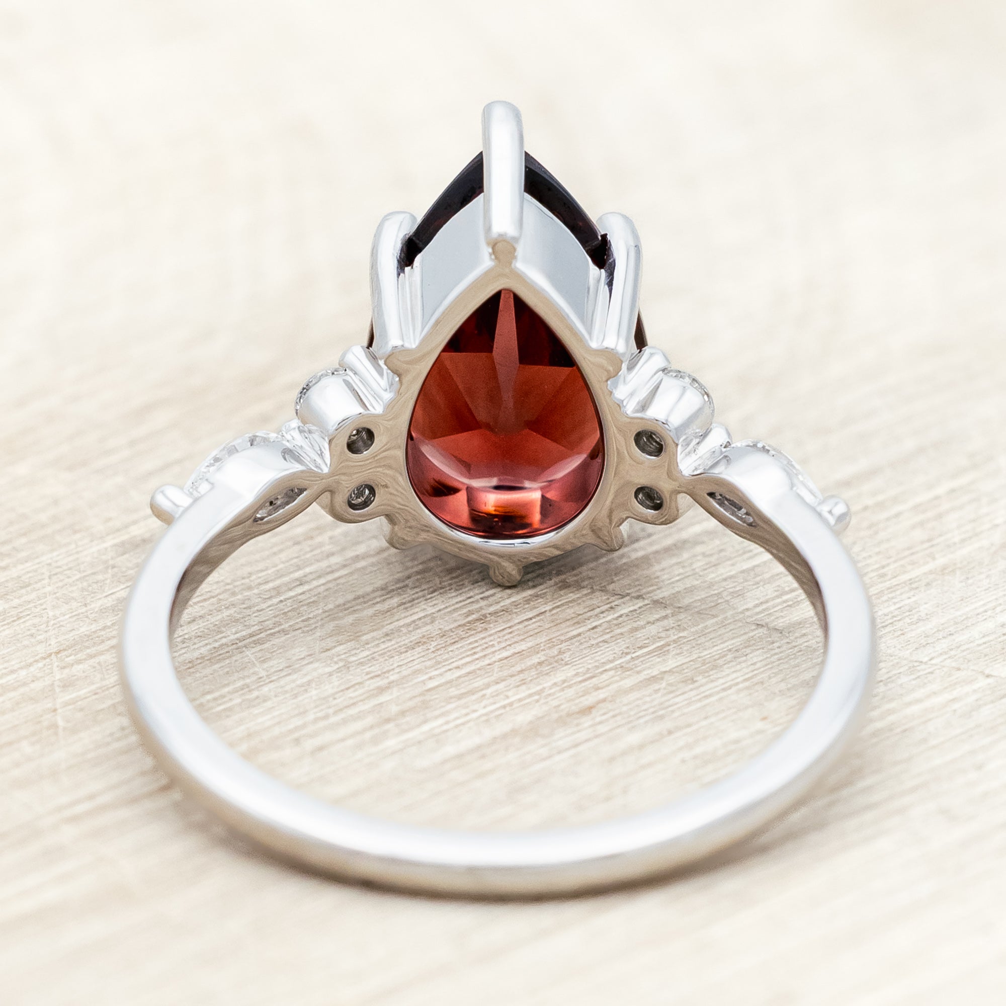 "SAGE" - PEAR CUT MOZAMBIQUE GARNET ENGAGEMENT RING WITH DIAMOND ACCENTS & "FALA" TRACER-Staghead Designs