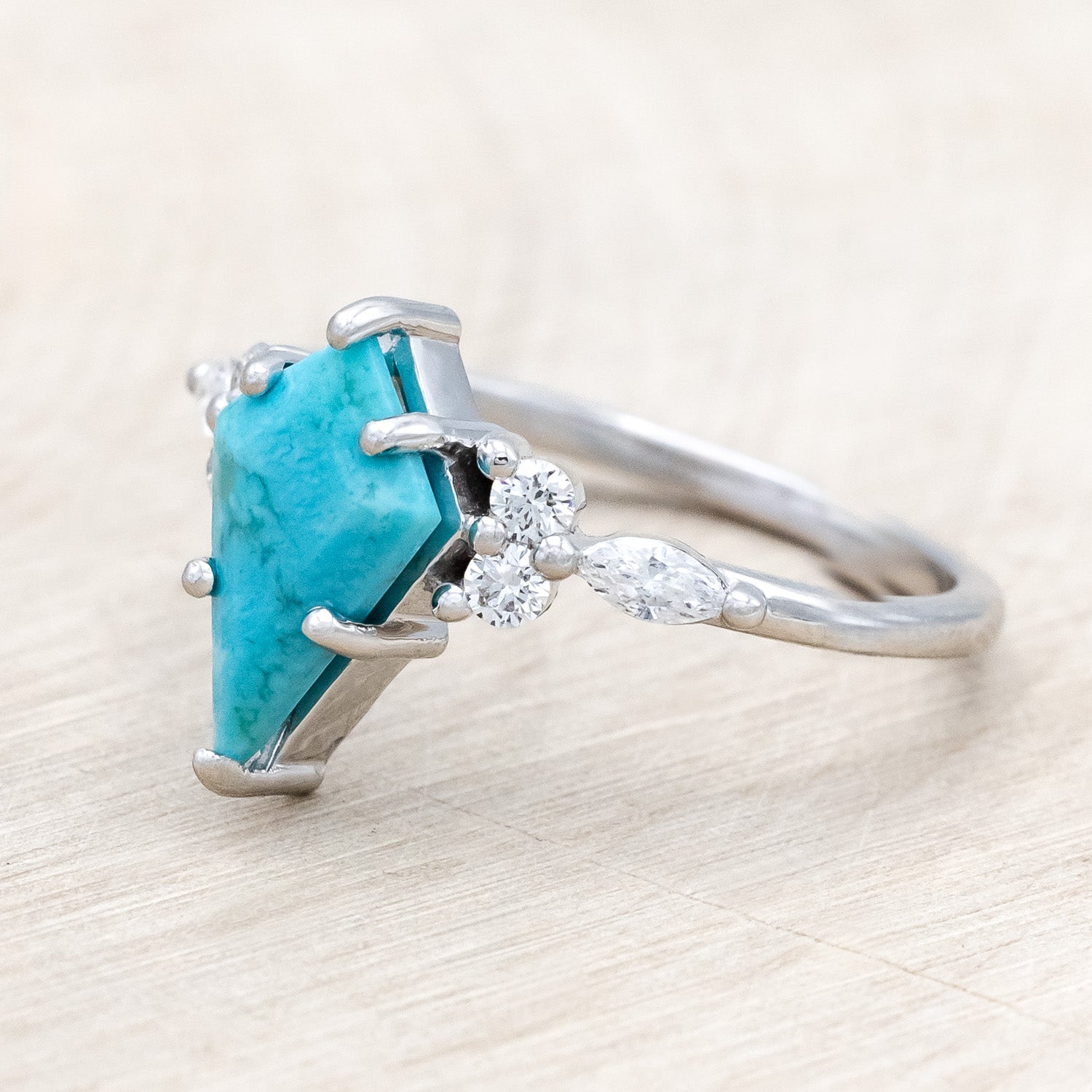 Side view of "Sage" - kite-cut stabilized turquoise women's engagement ring with diamond accents