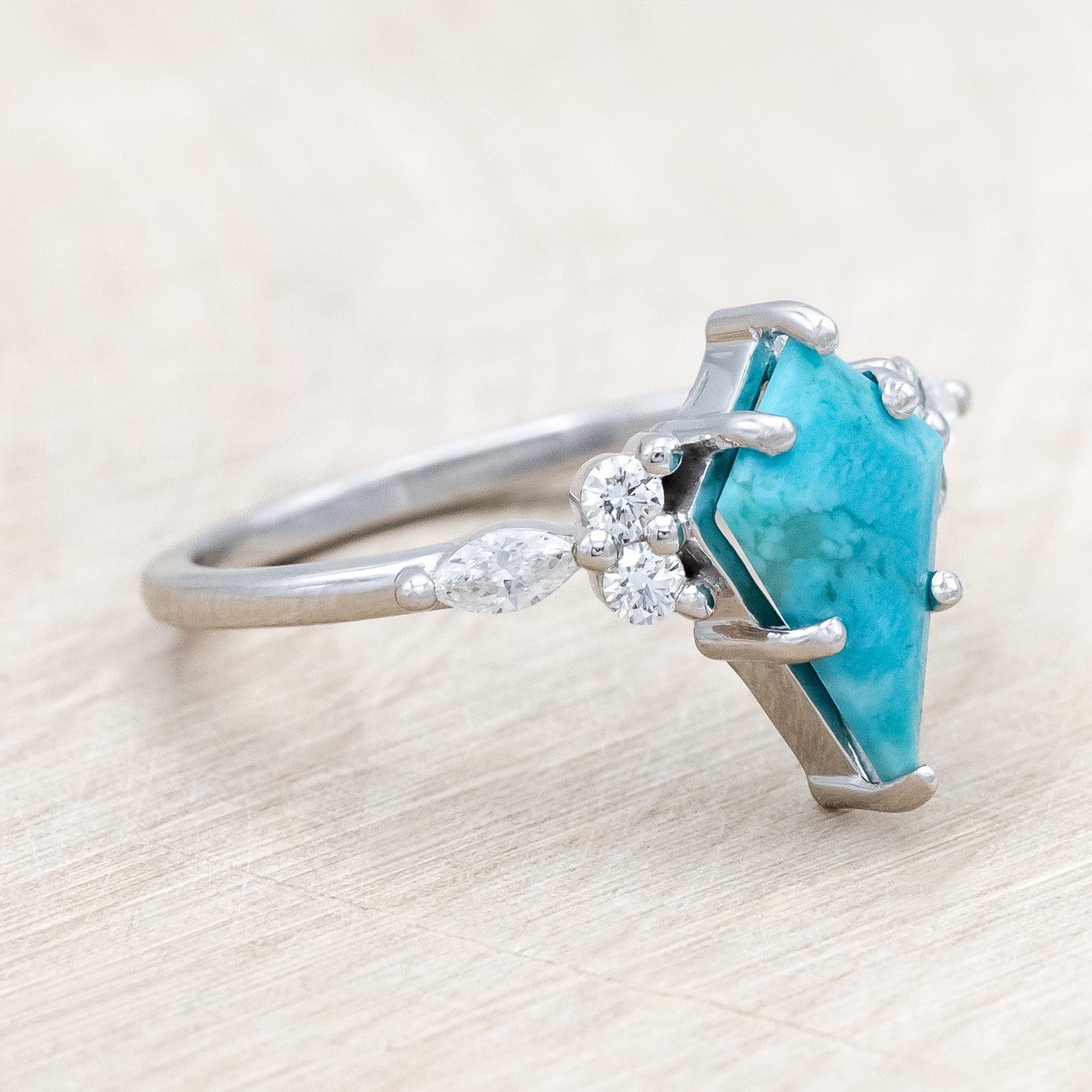 Side view of "Sage" - kite-cut stabilized turquoise women's engagement ring with diamond accents