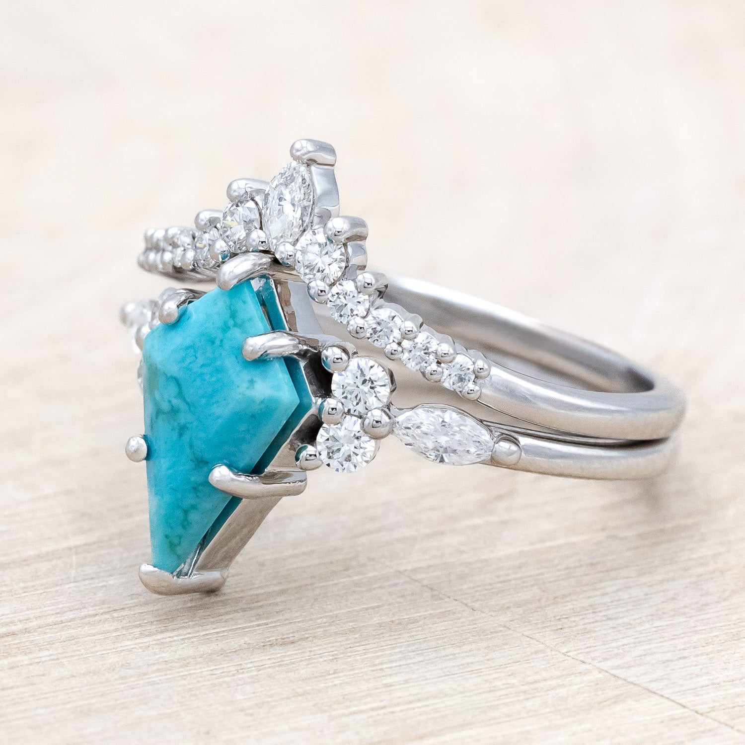 Side view of "Sage" - kite-cut stabilized turquoise women's engagement ring with diamond accents & tracer