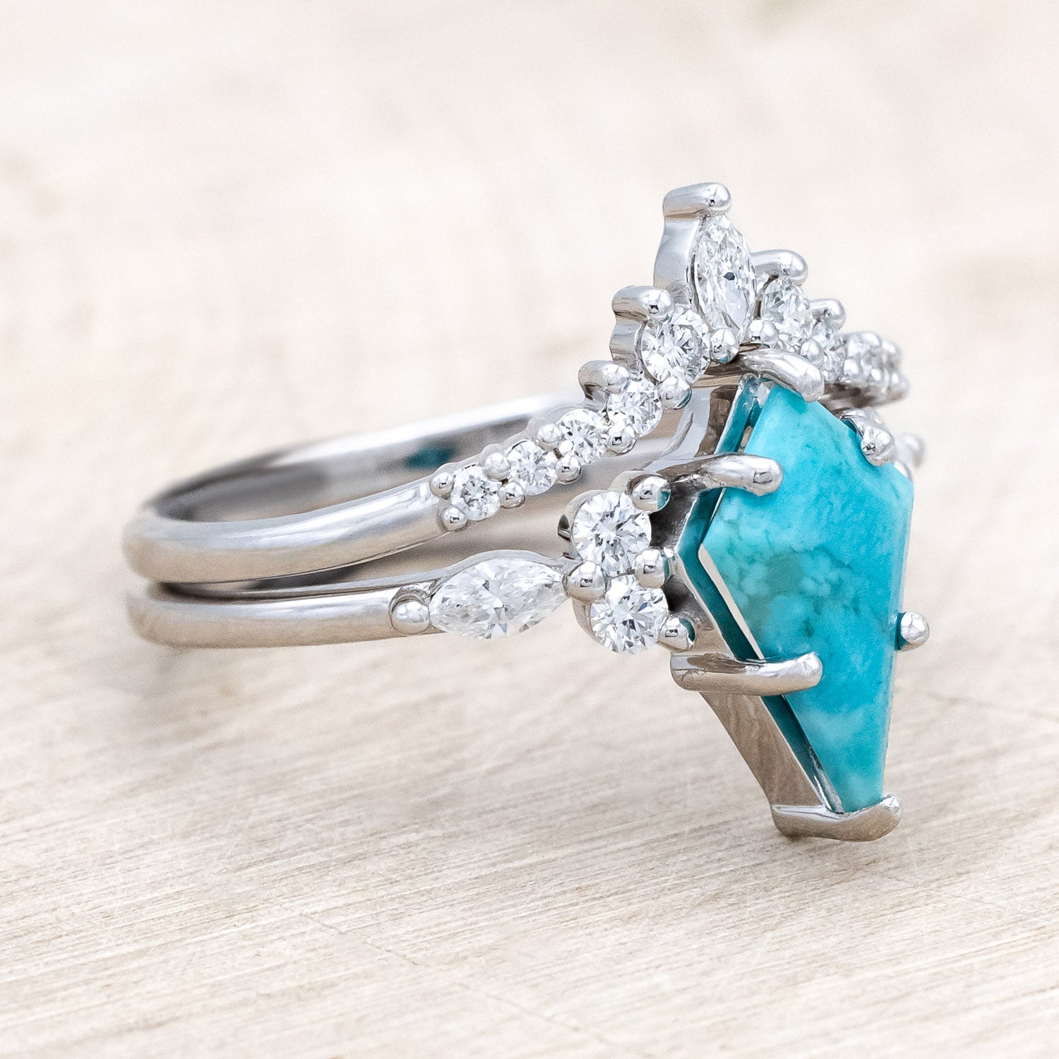 Side view of "Sage" - kite-cut stabilized turquoise women's engagement ring with diamond accents & tracer