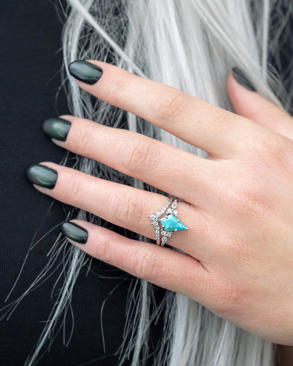 On hand photo of "Sage" - kite-cut stabilized turquoise women's engagement ring with diamond accents & tracer