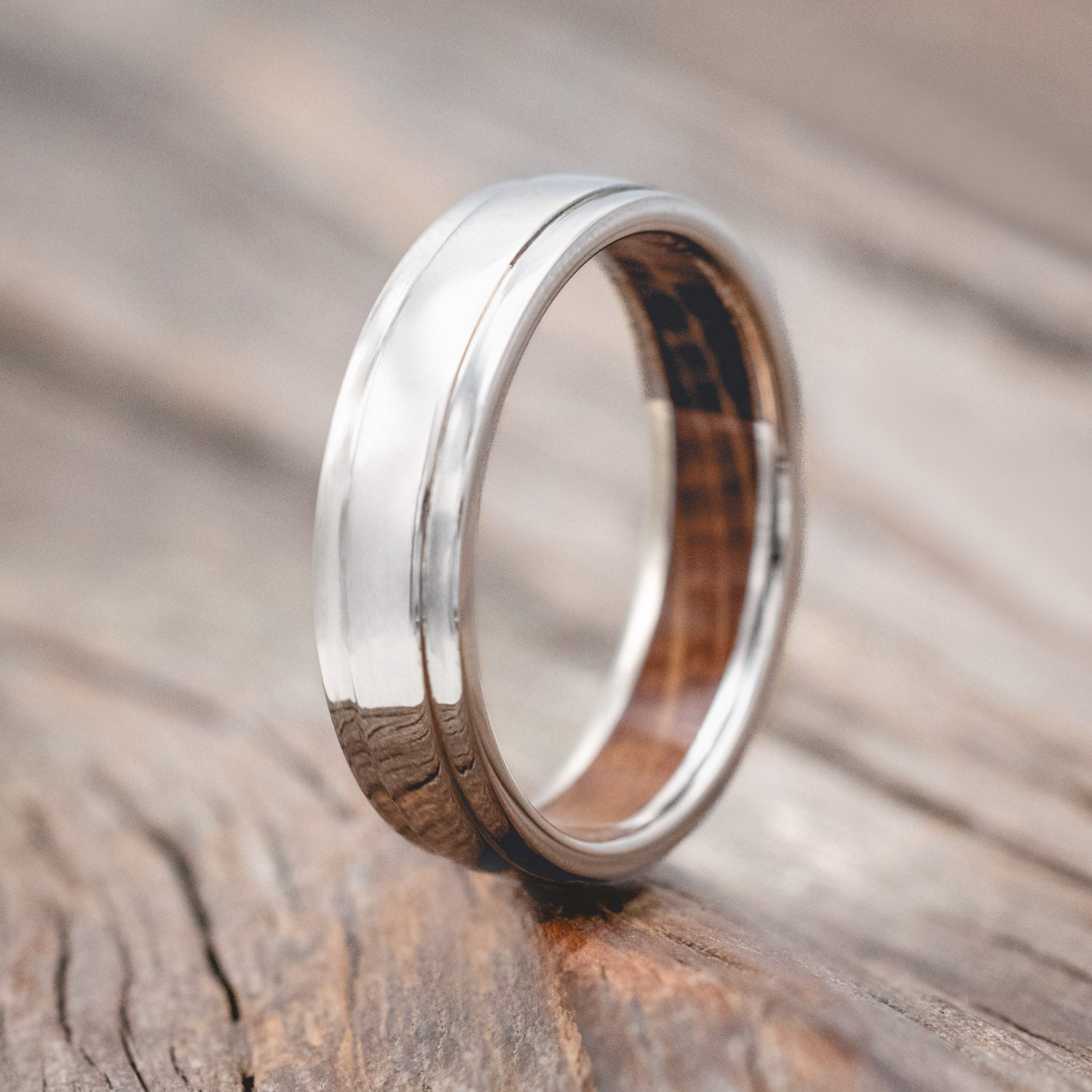 "SEDONA" - RAISED CENTER WEDDING RING FEATURING A WHISKEY BARREL LINED 14K GOLD BAND-Staghead Designs