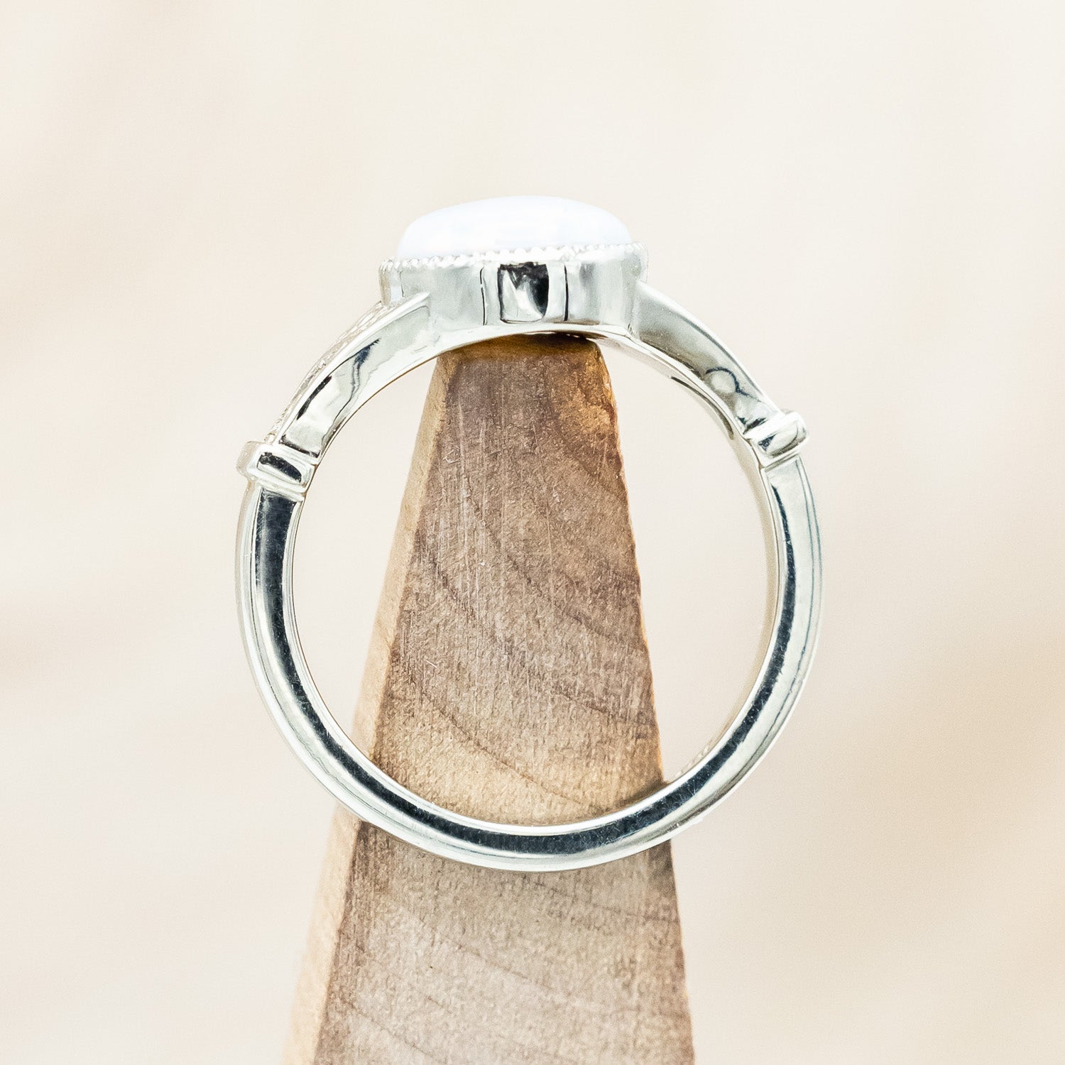 Top view of "Selene"  - Australian opal women's engagement ring with crescent moon engravings in 14K white gold