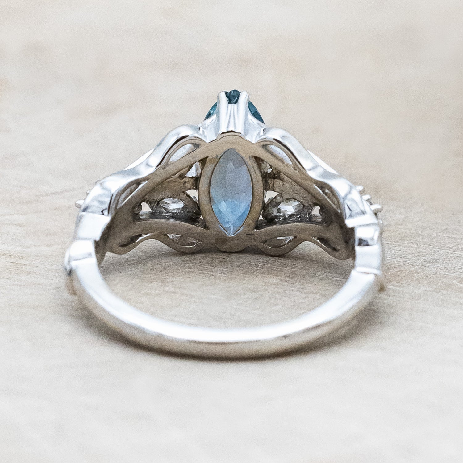 Back view of "Amarie" - diamond accented engagement ring with an abstract filigree cutout