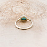 "SASI" - OVAL CABOCHON TURQUOISE ENGAGEMENT RING WITH DIAMOND ACCENTS