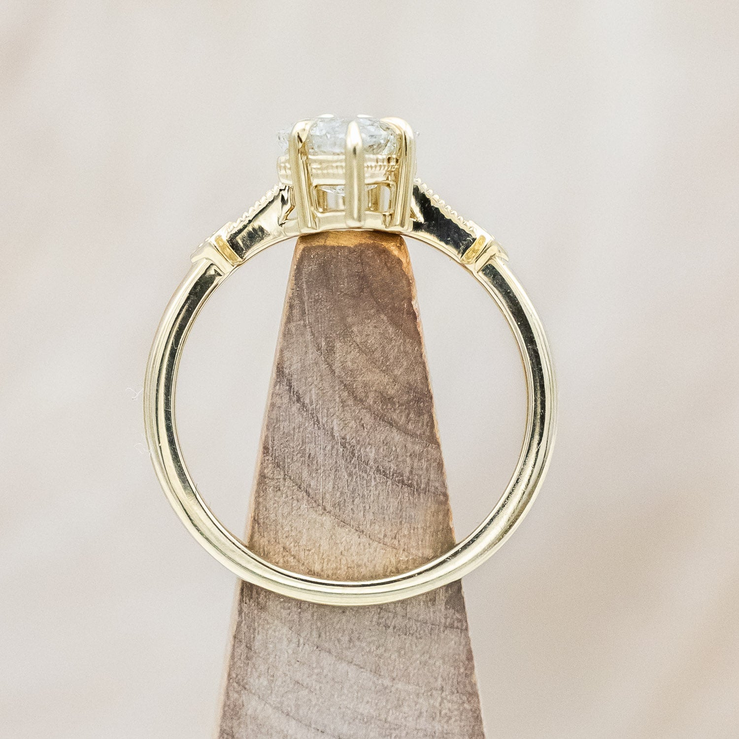 Side view of "Annora" - vintage-style women's engagement ring with kite step cut salt & pepper diamond & diamond accents in 14K yellow gold