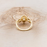 "ARTEMIS ON THE VINE DIVINE" - PEAR MOISSANITE ENGAGEMENT RING WITH DIAMOND ACCENTS & A BRANCH-STYLE BAND