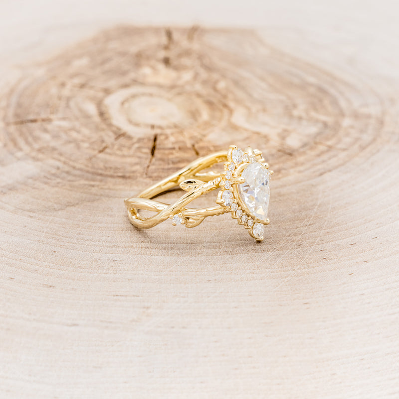 "ARTEMIS ON THE VINE DIVINE" - PEAR MOISSANITE ENGAGEMENT RING WITH DIAMOND ACCENTS & A BRANCH-STYLE BAND