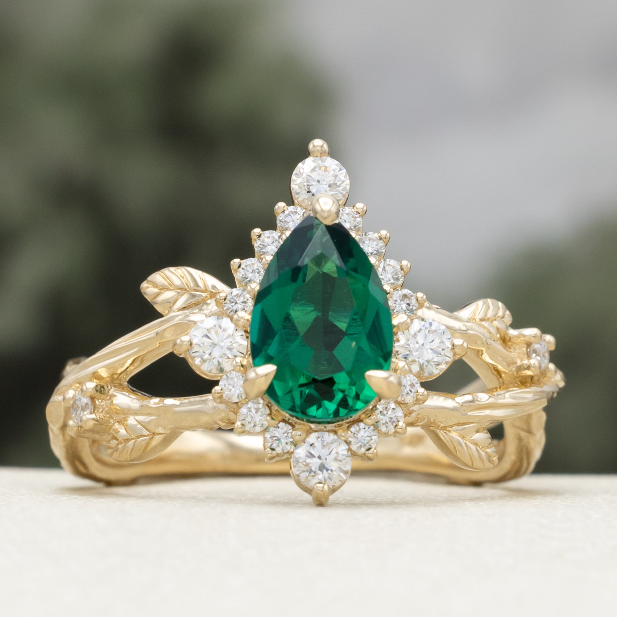 "ARTEMIS ON THE VINE DIVINE" - PEAR CUT LAB-GROWN EMERALD ENGAGEMENT RING WITH DIAMOND ACCENTS & A BRANCH-STYLE BAND-Staghead Designs
