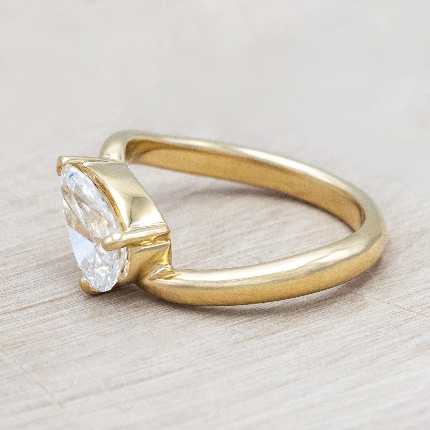 Side view of "Sybil" - asymmetrical solitaire-style lab diamond women's engagement ring