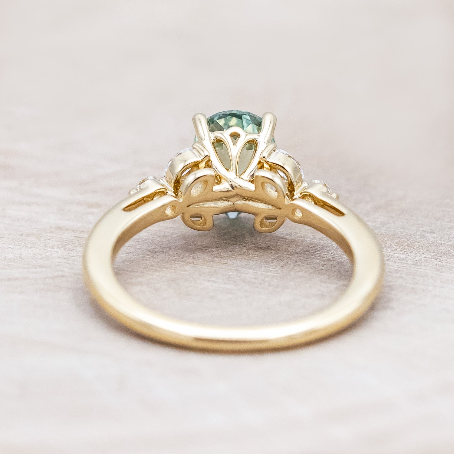 Back view of "Blossom" - pear cut lab-grown green sapphire women's engagement ring with diamond accents