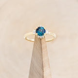 "CORALIE" - ROUND CUT LAB-GROWN ALEXANDRITE ENGAGEMENT RING WITH A DIAMOND HALO