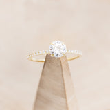 "RAMONA" - 4 PRONG ROUND CUT MOISSANITE ENGAGEMENT RING WITH DIAMOND ACCENTS