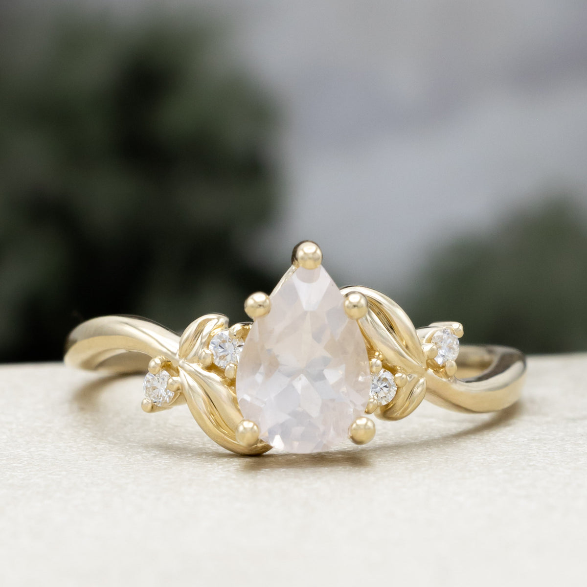 "Gladys" - Pear Cut Rose Quartz Engagement Ring With Diamond Accents On A Floral-Style Band