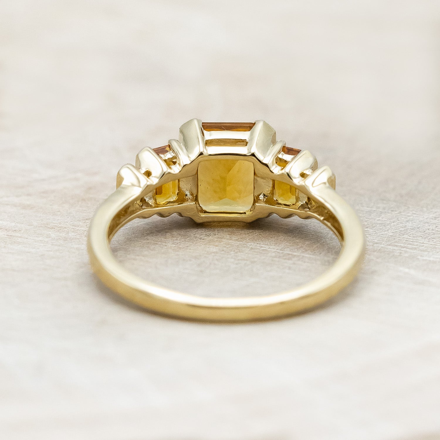 Back view of "Hazel" - accented-style citrine women's engagement ring with citrine accents on a 14K gold miligrain band