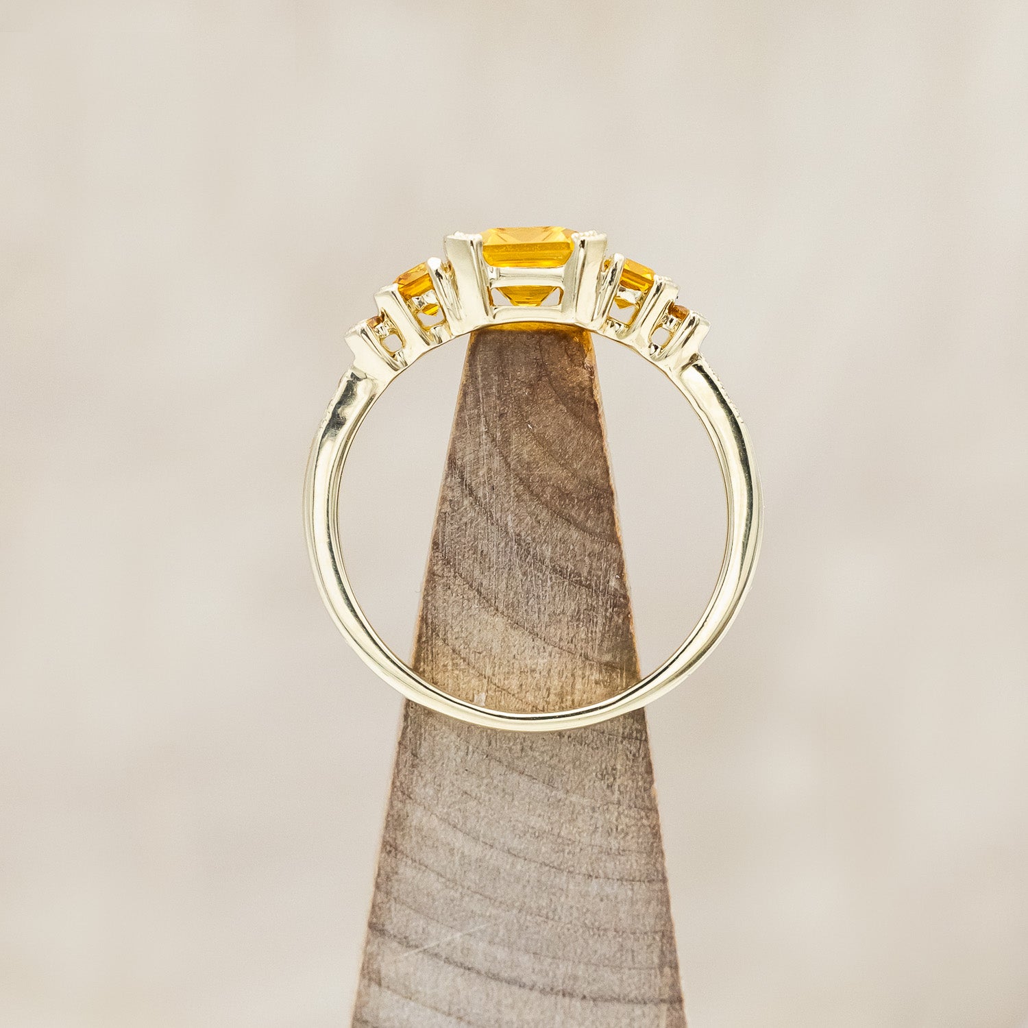 Top view of "Hazel" - accented-style citrine women's engagement ring with citrine accents on a 14K gold miligrain band