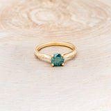 "HOPE" - ROUND CUT MEDEINA GREEN MOISSANITE SOLITAIRE ENGAGEMENT RING WITH FEATHER ACCENTS