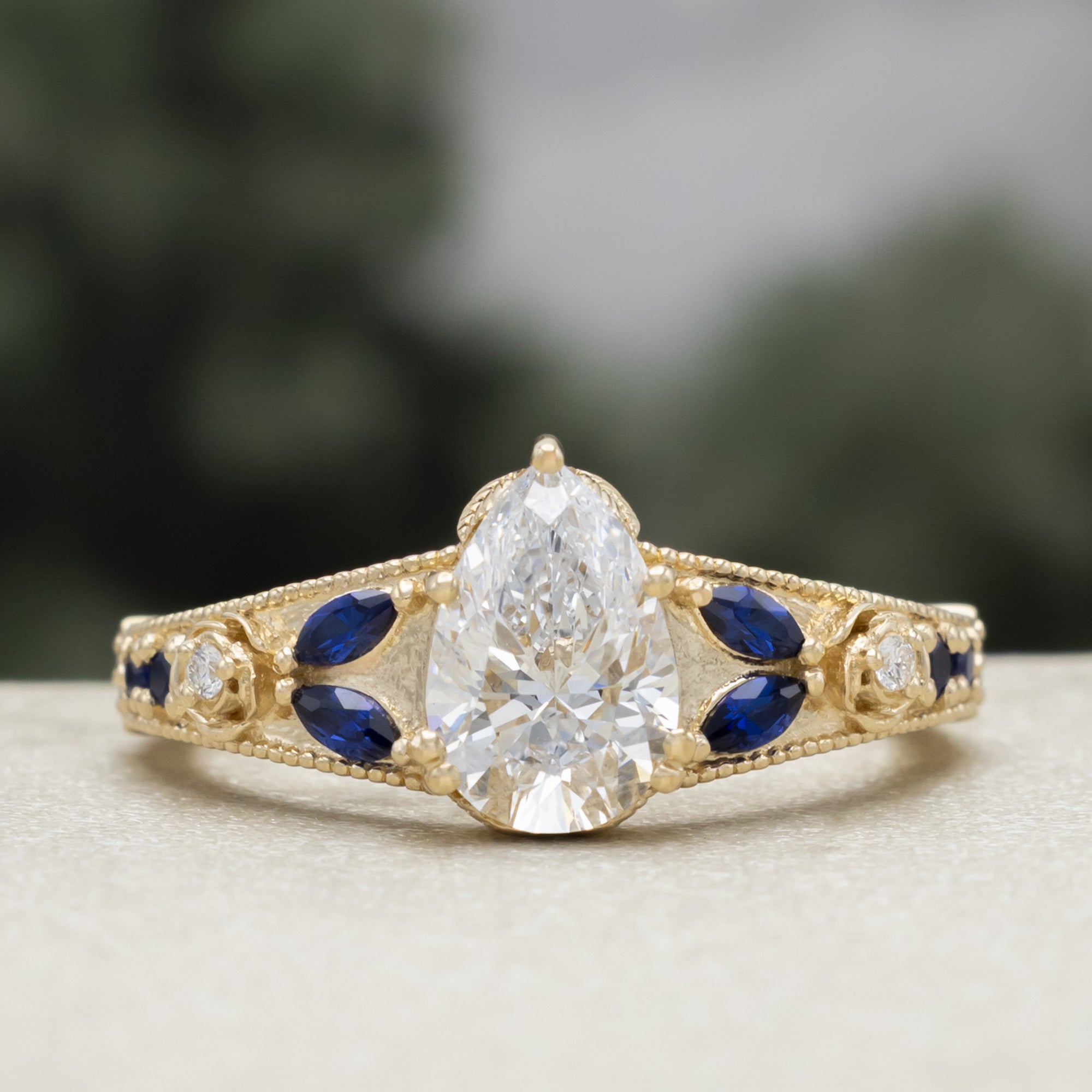 "Iris" - Lab-Grown Pear Cut Diamond Engagement Ring With Diamond & Lab-Grown Blue Sapphire Accents-Staghead Designs