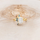 "GABRIELLA" - EMERALD CUT MOISSANITE ENGAGEMENT RING WITH AQUAMARINE ACCENTS IN A TWISTED BAND-4