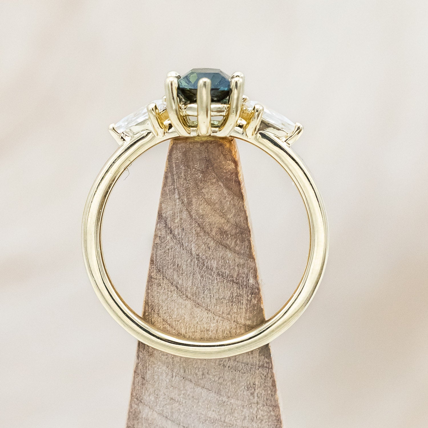 Front view of"Isla" - elongated hexagon cut Australian sapphire with moissanite accents in 14K yellow gold
