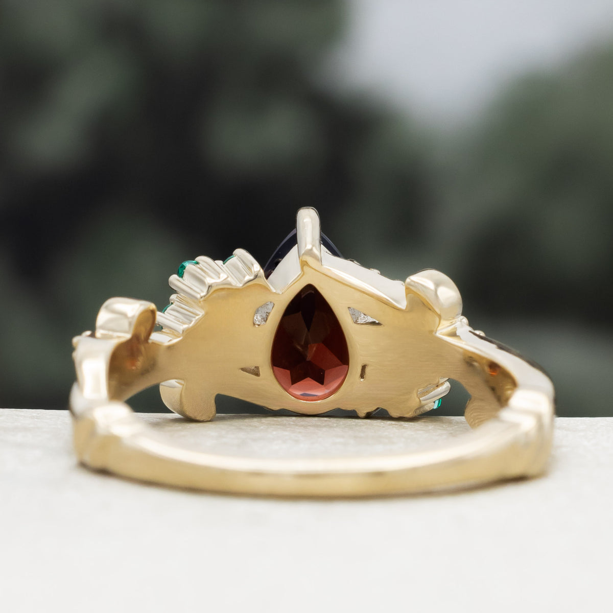 "Kamila" - Pear Cut Mozambique Garnet Engagement Ring With Lab-Grown Emerald & Diamond Accents-Staghead Designs
