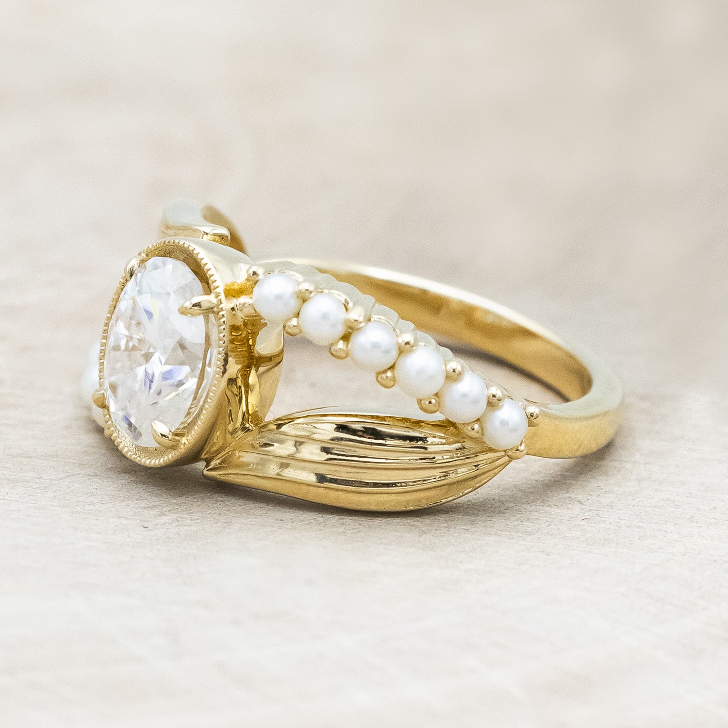 "Lily" an oval cut moissanite women's engagement ring with pearl accents