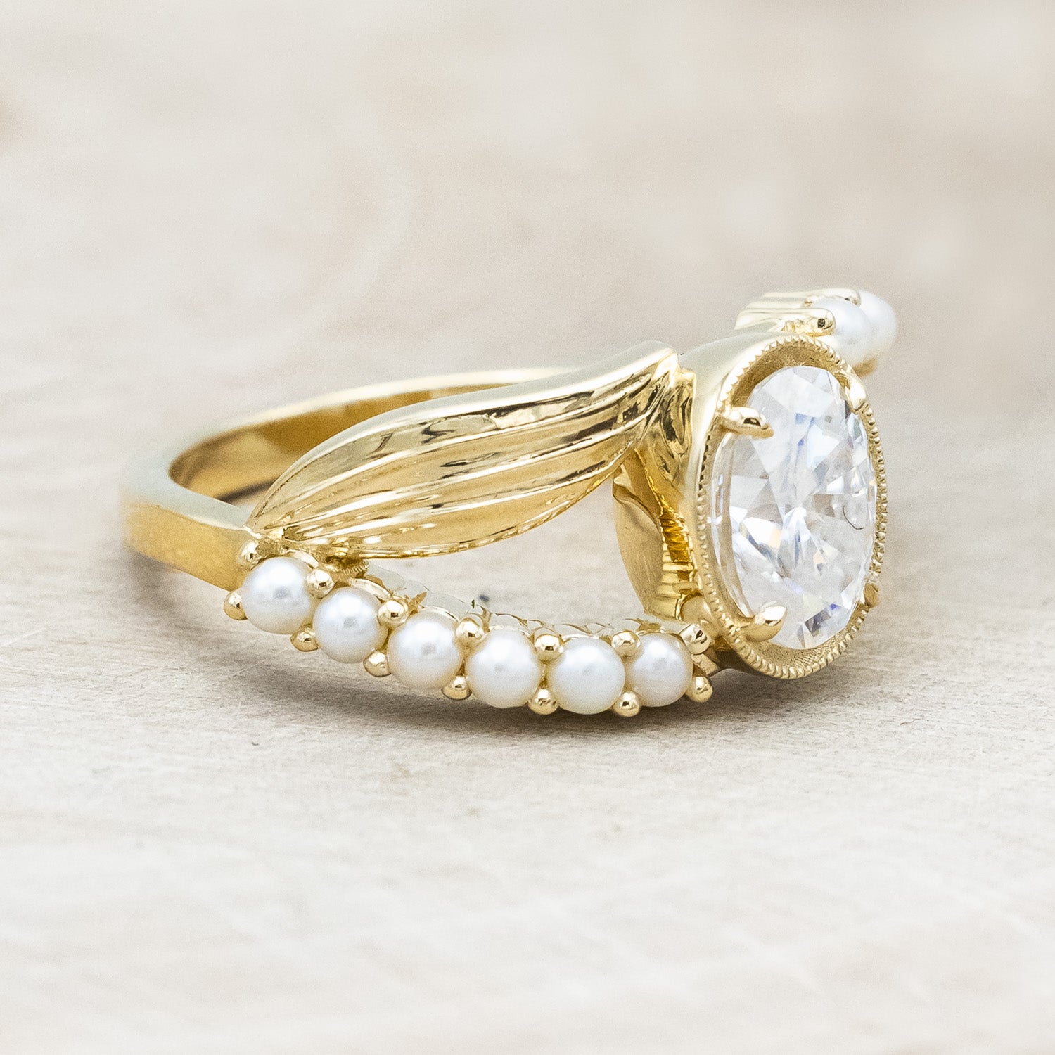 "Lily" an oval cut moissanite women's engagement ring with pearl accents