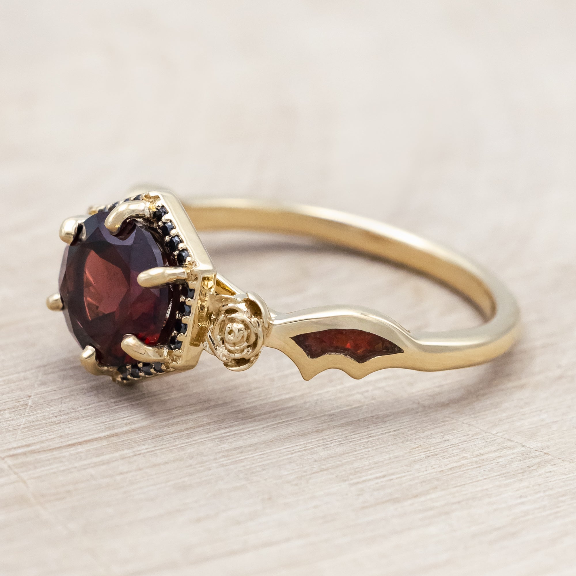 "LUCY IN THE SKY" - ROUND CUT GARNET ENGAGEMENT RING WITH BLACK DIAMONDS, ROSE ACCENTS & BAT WING SHAPED RED OPAL INLAYS-Staghead Designs