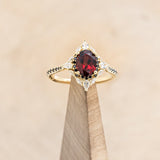 "NORTH STAR" - OVAL GARNET ENGAGEMENT RING WITH BLACK & WHITE DIAMOND HALO & ACCENTS