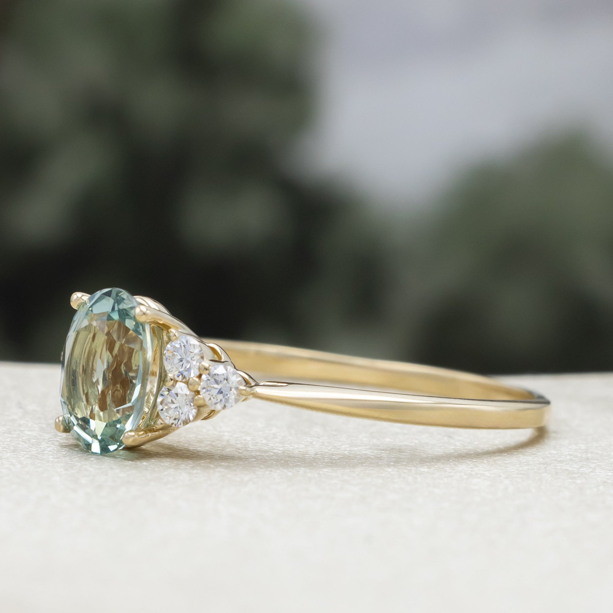 "Rhea" - Oval Cut Lab-Grown Green Sapphire Engagement Ring With Diamond Accents