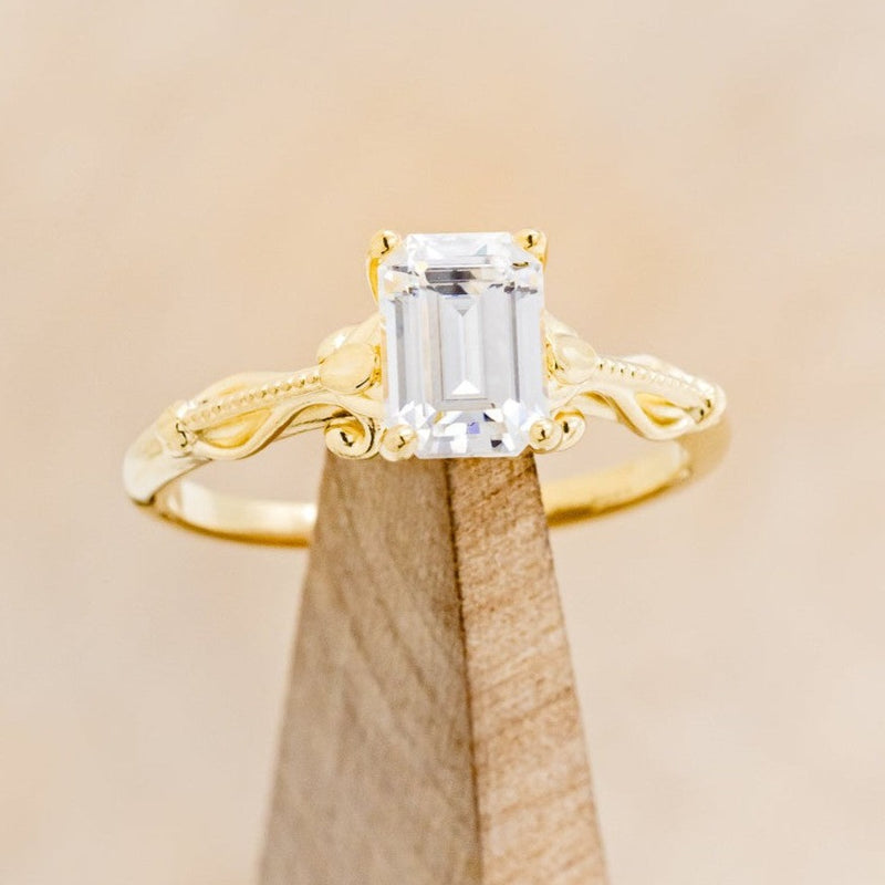 "ROSEMARY" - FLORAL-STYLE ENGAGEMENT RING WITH EMERALD CUT MOISSANITE
