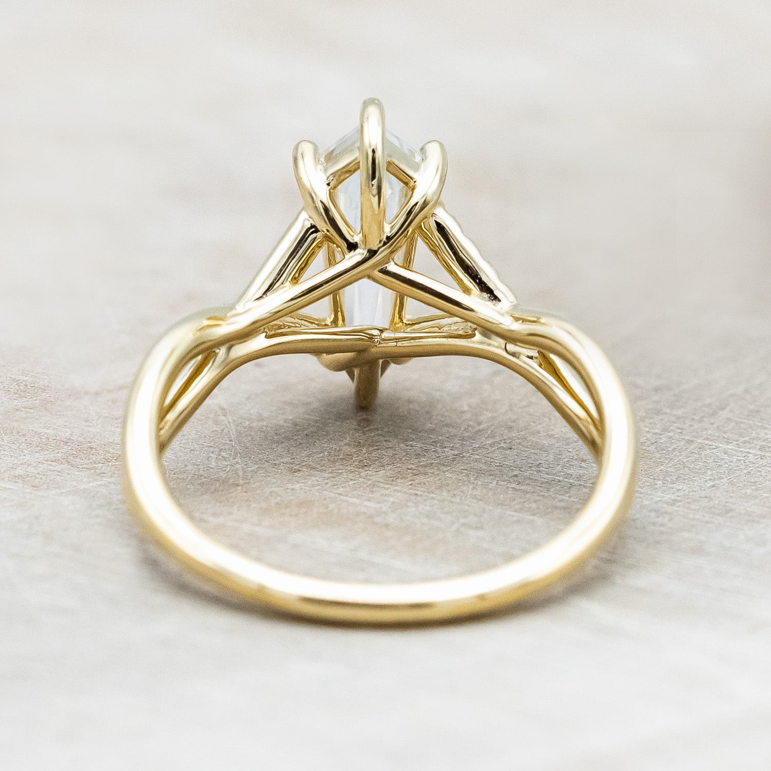 Back view of "Roslyn" - elongated kite cut moissanite women's engagement ring with diamond accents in 14K yellow gold