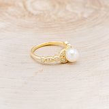 ROUND WHITE AKOYA PEARL ENGAGEMENT RING WITH DIAMOND ACCENTS