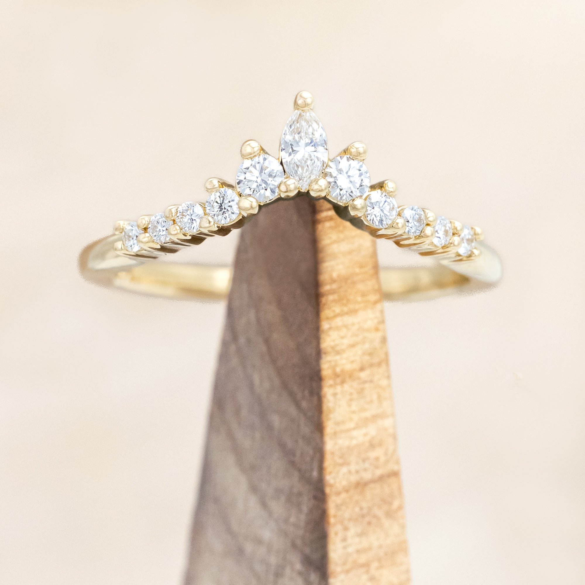 14K gold ring with diamond accents on a neutral background