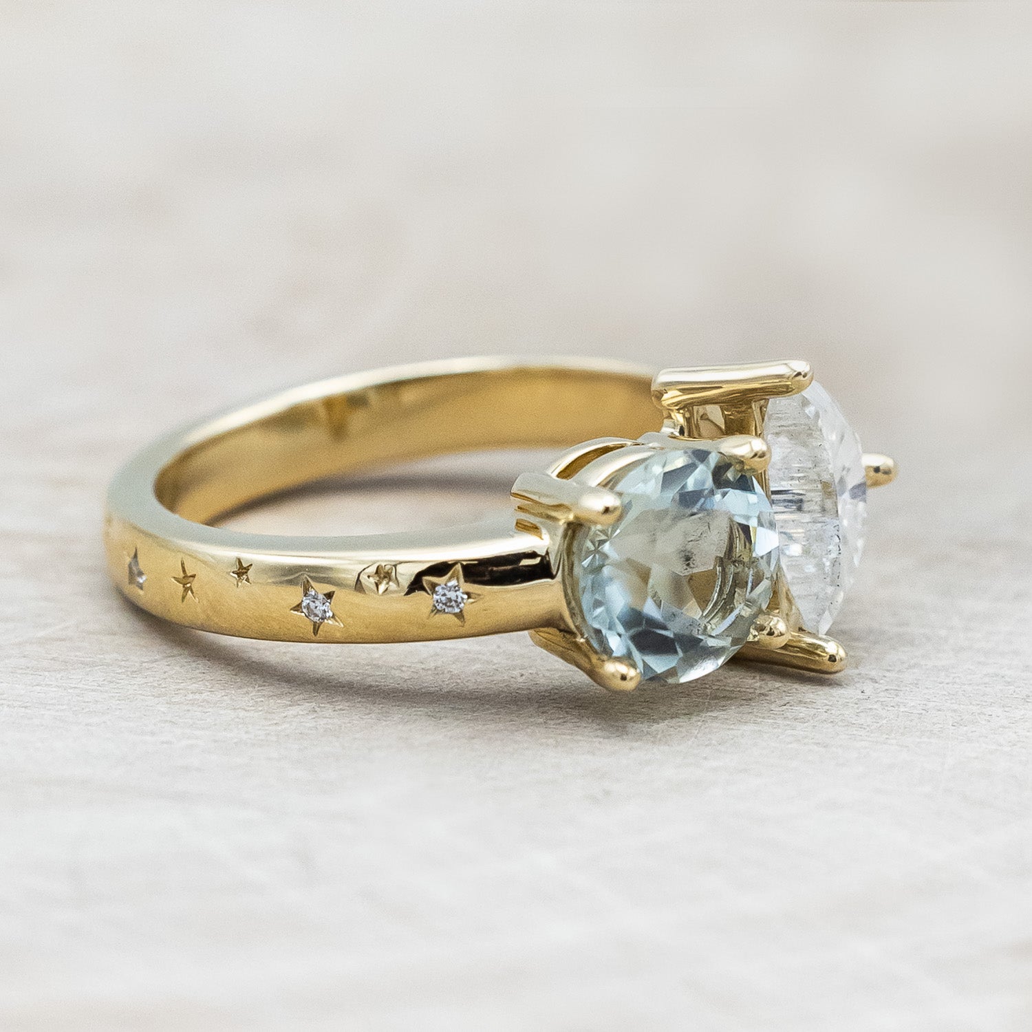 Side view of "Sidra" - toi et moi round cut green prasiolite women's engagement ring with a crescent moon moissanite accent