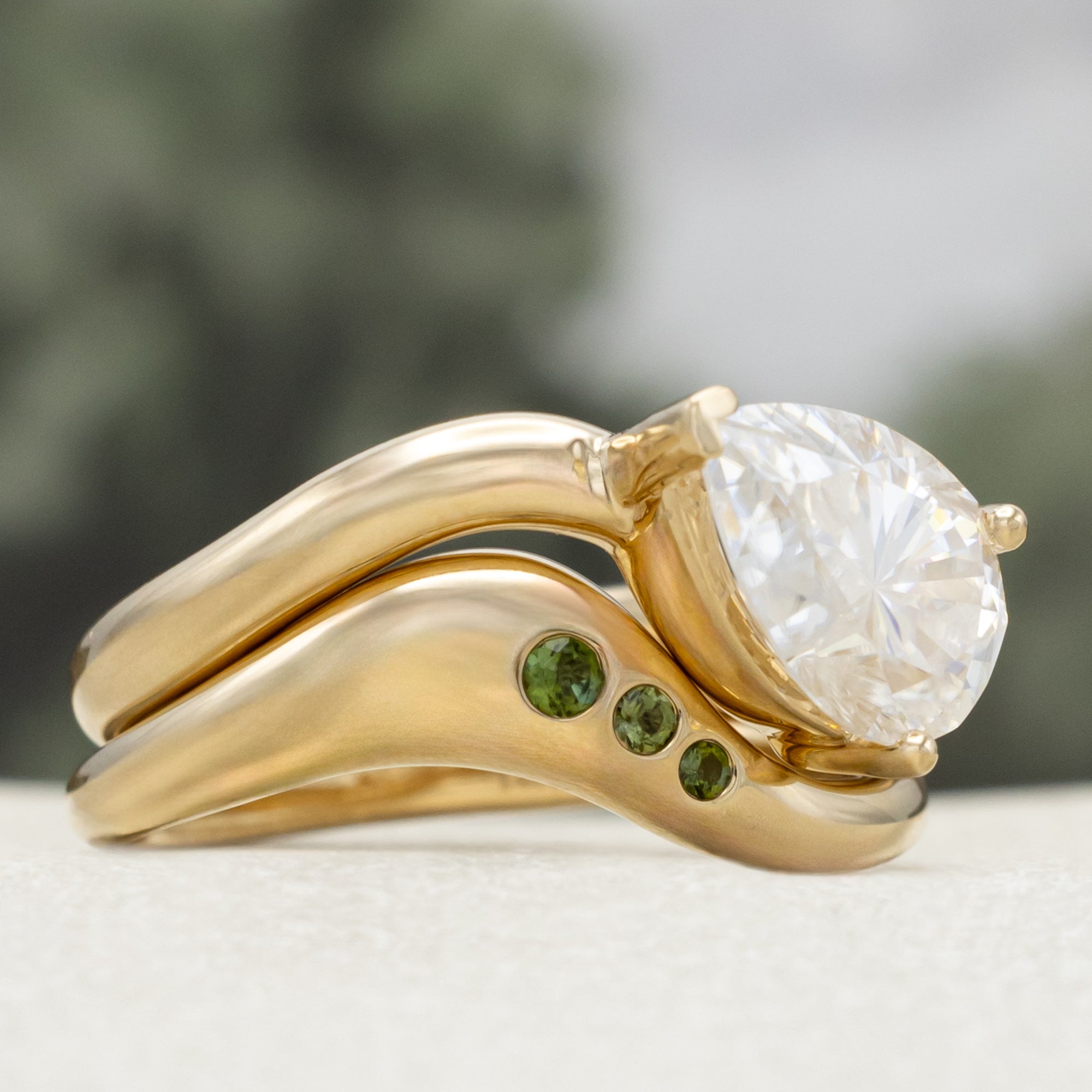 "SYBIL" - PEAR CUT MOISSANITE ASYMMETRICAL ENGAGEMENT RING WITH A GREEN TOURMALINE ACCENTED TRACER-Staghead Designs