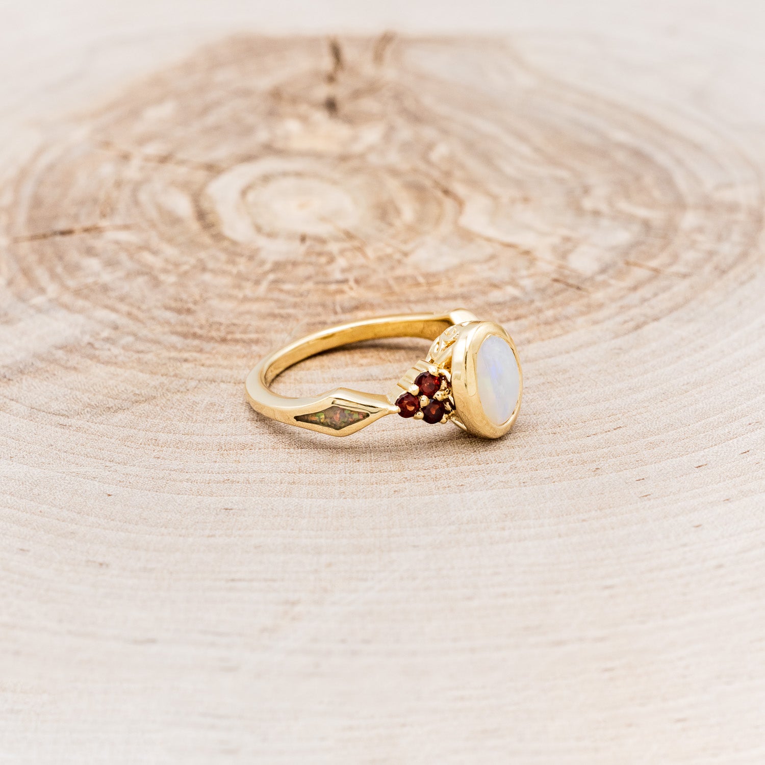 "AGATHA" - BEZEL SET OVAL CABOCHON CUT WHITE OPAL ENGAGEMENT RING WITH GARNET ACCENTS AND FIRE & ICE OPAL INLAYS-Staghead Designs