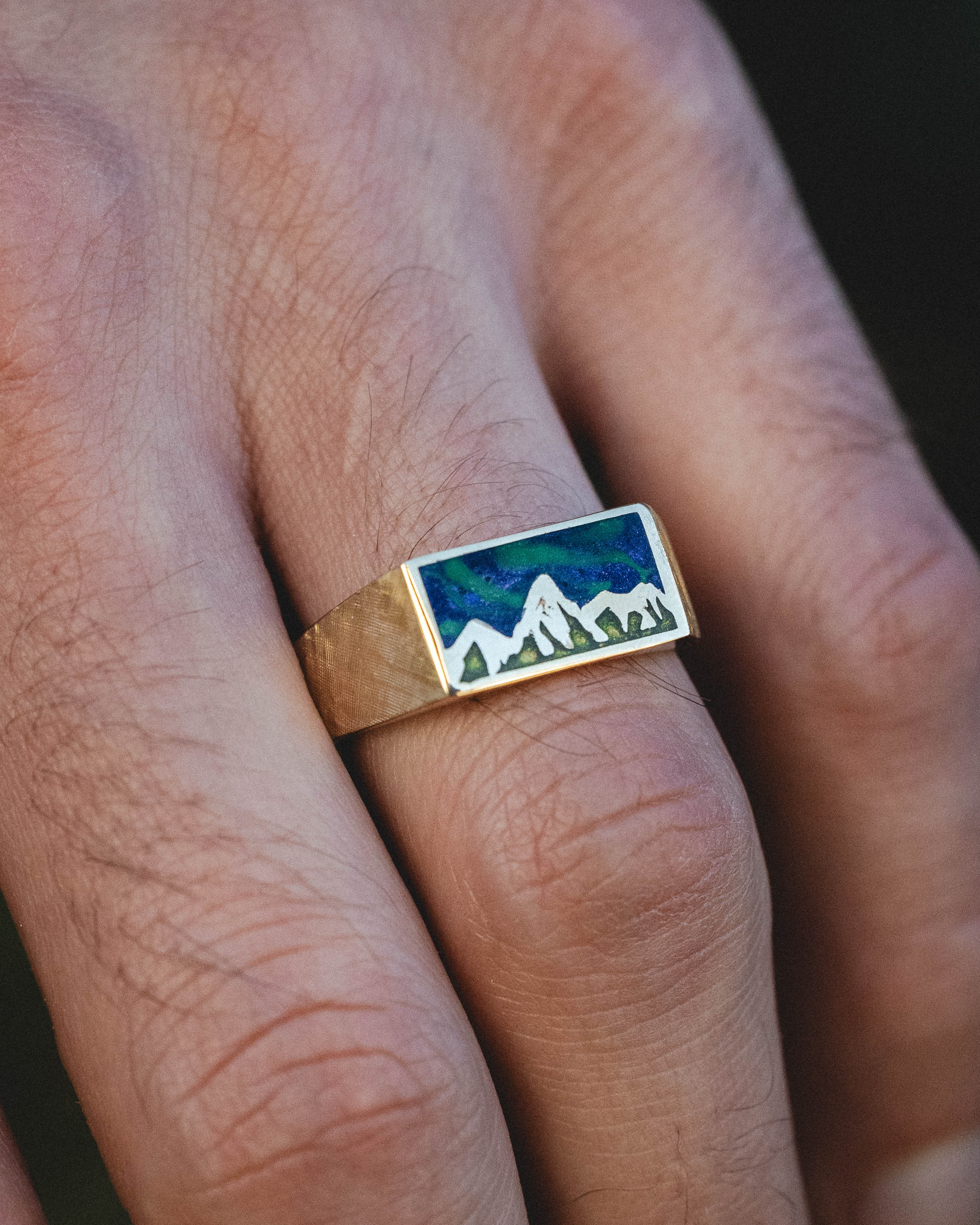 "ATLAS" - MOUNTAIN ENGRAVED WEDDING BAND WITH GLOW IN THE DARK NORTHERN LIGHTS, A MYSTIC MOSS INLAY, AND A FLORENTINE FINISH-Staghead Designs